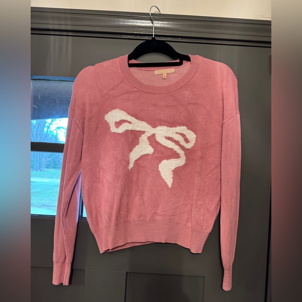 Juniors size large Pink Sweater with White Bow Design